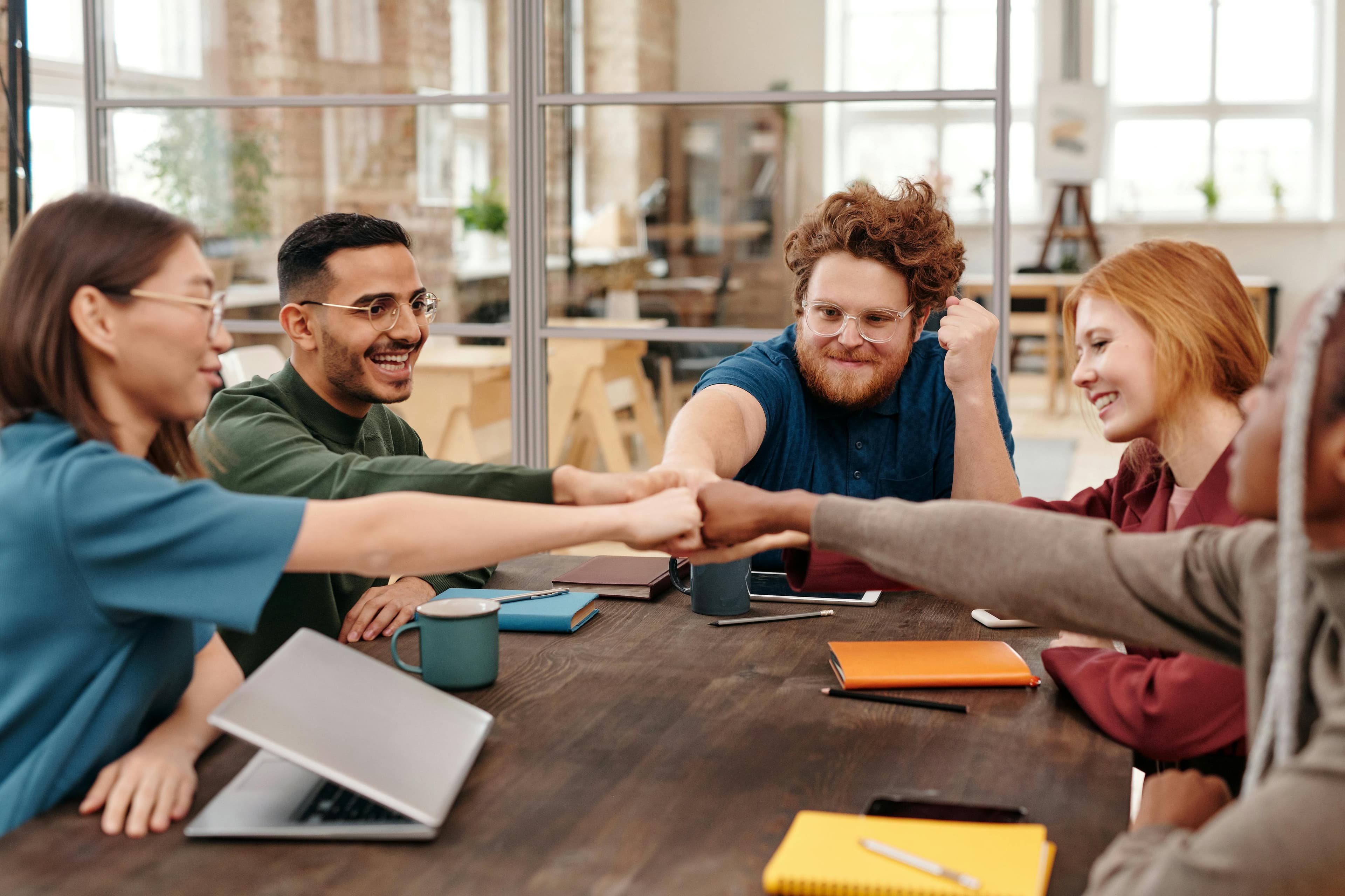 Lawyers in a law firm collaborating across practice groups over coffee
